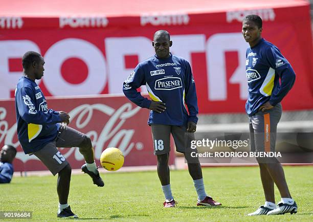 Ecuadorean footballers : Walter Ayovi, Neicer Reascos and Antonio Valencia, take part in training session on August 31 2009 in Quito. Ecuador will...