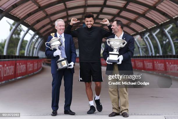 Jo-Wilfried Tsonga of France poses with Acting Sports Minister Philip Dalidakis and Australian Open Tournament Director Craig Tiley ahead of the 2018...