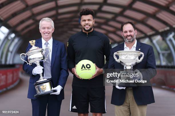 Jo-Wilfried Tsonga of France poses with Acting Sports Minister Philip Dalidakis and Australian Open Tournament Director Craig Tiley ahead of the 2018...