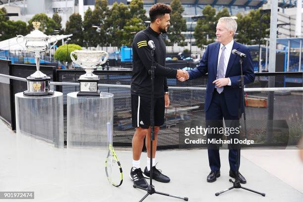 Jo-Wilfried Tsonga of France meets with Australian Open Tournament Director Craig Tiley ahead of the 2018 Australian Open at Melbourne Park on...
