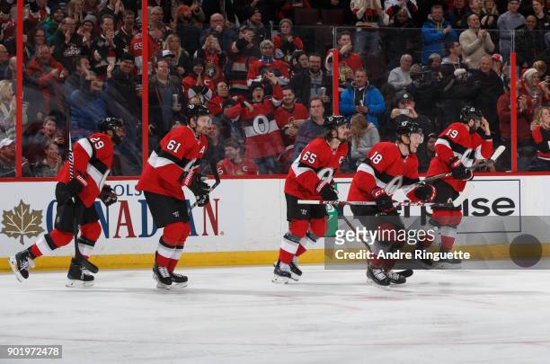 Ryan Dzingel of the Ottawa Senators celebrates his first period goal against the Tampa Bay Lightning with teammates Johnny Oduya, Mark Stone, Erik...
