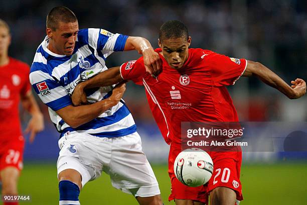 Sandro Wagner of Duisburg is challenged by Anderson of Duesseldorf during the 2. Bundesliga match between MSV Duisburg and Fortuna Duesseldorf at the...