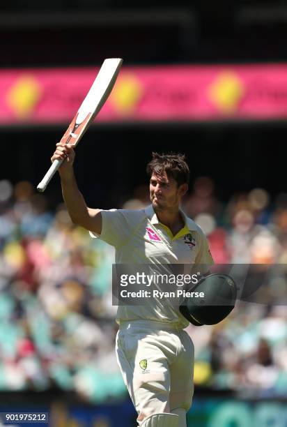 Mitch Marsh of Australia raises his bat as he leaves the ground after being dismissed for 101 runs during day four of the Fifth Test match in the...