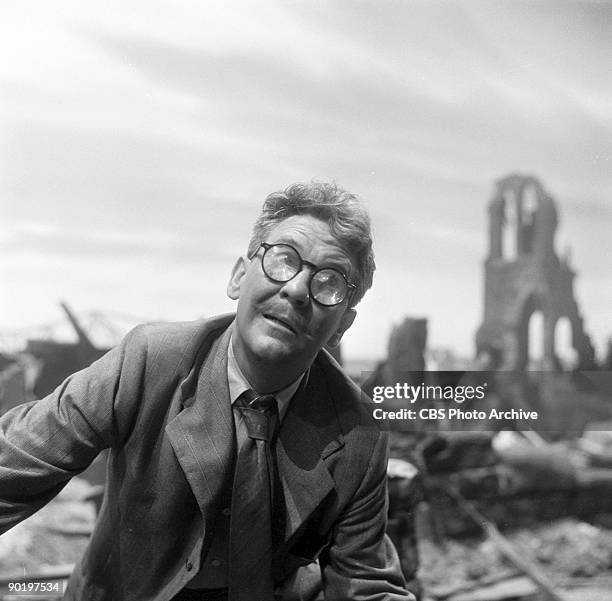 Actor Burgess Meredith as Henry Bemis, in a scenes from "Time Enough at Last", episode 8 from the first season of the CBS series 'The Twilight Zone',...