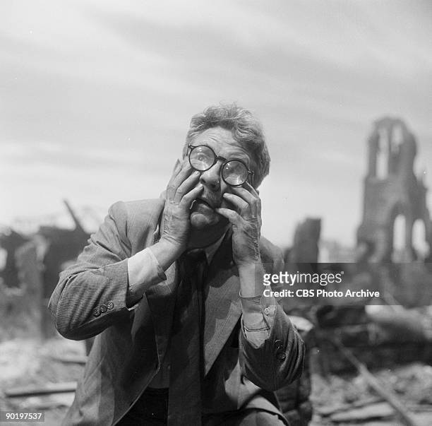 Actor Burgess Meredith as Henry Bemis, in a scenes from "Time Enough at Last", episode 8 from the first season of the CBS series 'The Twilight Zone',...
