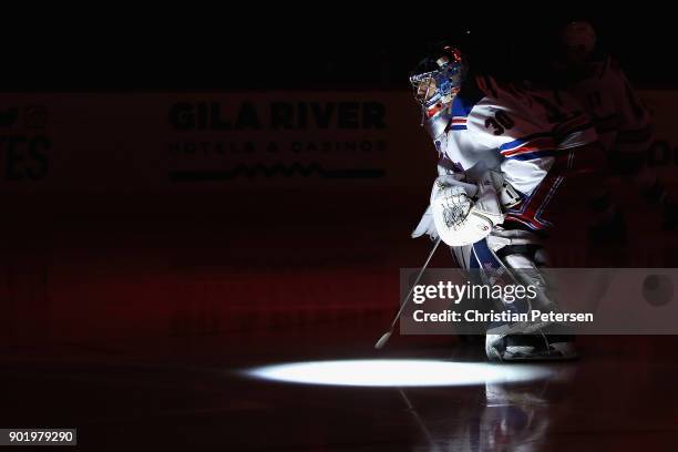 Goaltender Henrik Lundqvist of the New York Rangers skates onto the ice before the NHL game against the Arizona Coyotes at Gila River Arena on...