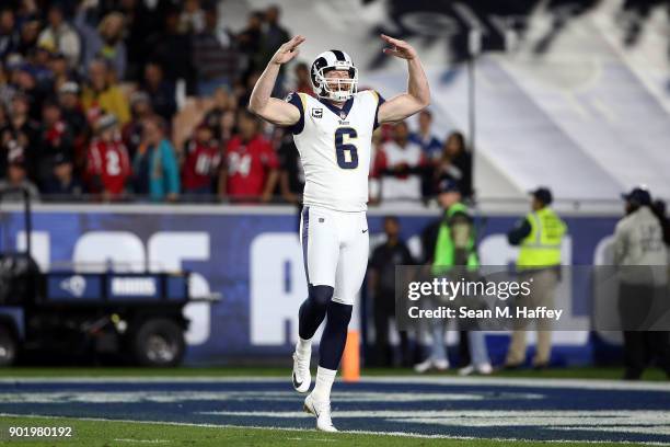 Johnny Hekker of the Los Angeles Rams reacts after a 66 yard punt in the first quarter during the NFC Wild Card Playoff Game against the Atlanta...