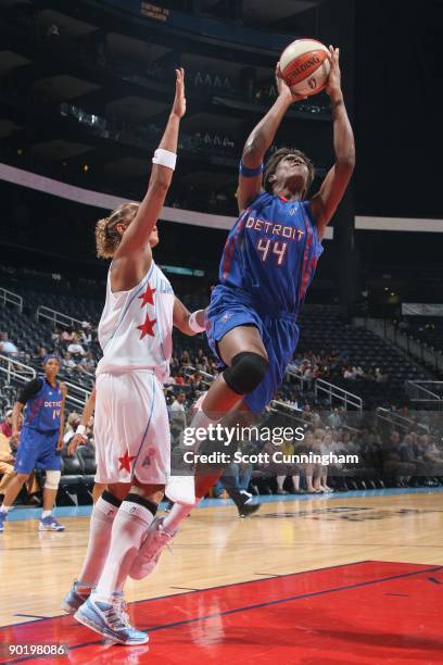 Taj McWilliams of the Detroit Shock shoots against Erika de Souza of the Atlanta Dream during the game at Philips Arena on August 13, 2009 in...