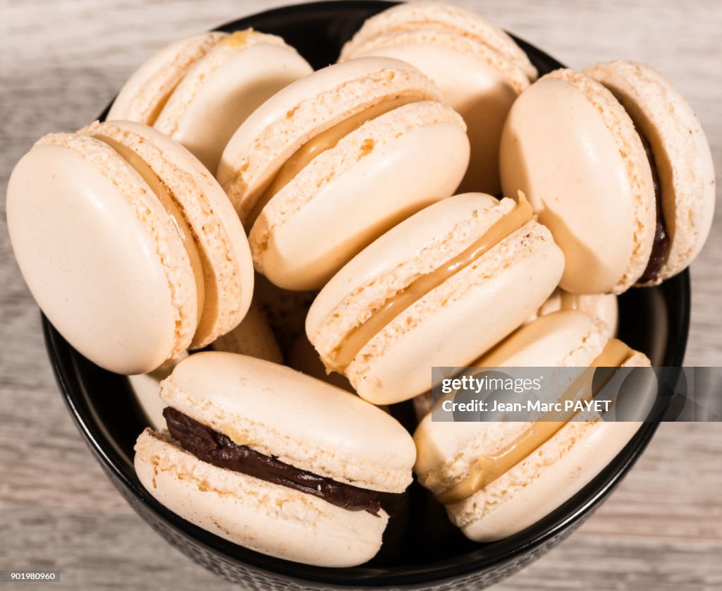 Aerial view of Macaroons piled in a black cup