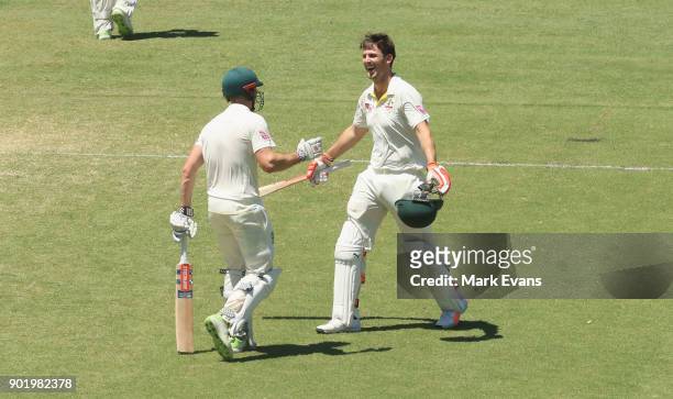 Mitch Marsh of Australia celebrates his century with brother Shaun Marshuring day four of the Fifth Test match in the 2017/18 Ashes Series between...
