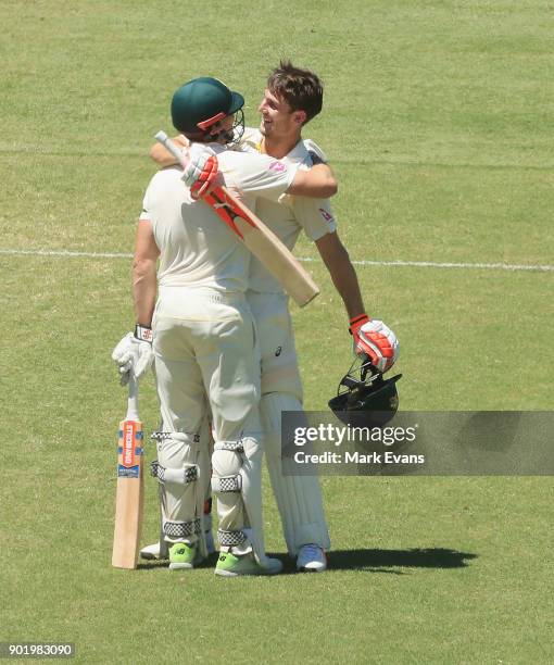 Mitch Marsh of Australia celebrates his century with brother Shaun Marsh during day four of the Fifth Test match in the 2017/18 Ashes Series between...