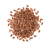 Pile of flax seeds on white background, top view