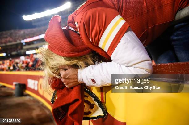 Deb Detwiler of Topeka, Kan., reacts after the Tennesee Titans took over on downs in the final two minutes against the Kansas City Chiefs on...