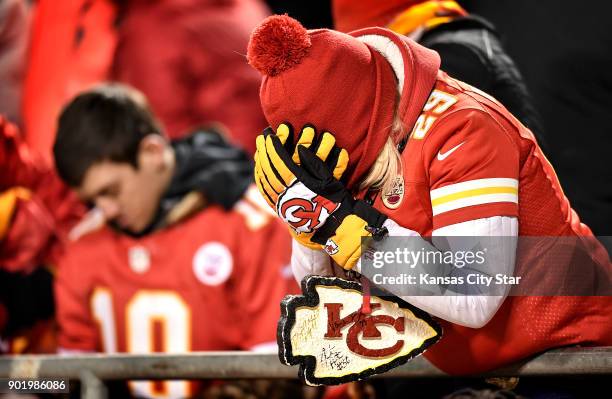 Deb Detwiler of Topeka, Kan., reacts after the Tennesee Titans took over on downs in the final two minutes against the Kansas City Chiefs on...