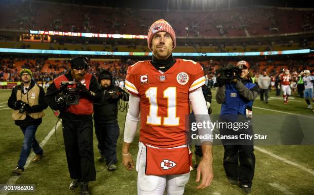 Kansas City Chiefs quarterback Alex Smith walks off the field after the Chiefs lost to the Tennessee Titans, 22-21, on Saturday, Jan. 6 during the...