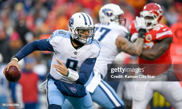 Tennessee Titans quarterback Marcus Mariota looks for room to run against the Kansas City Chiefs on Saturday, Jan. 6 during the AFC Wild Card playoff...