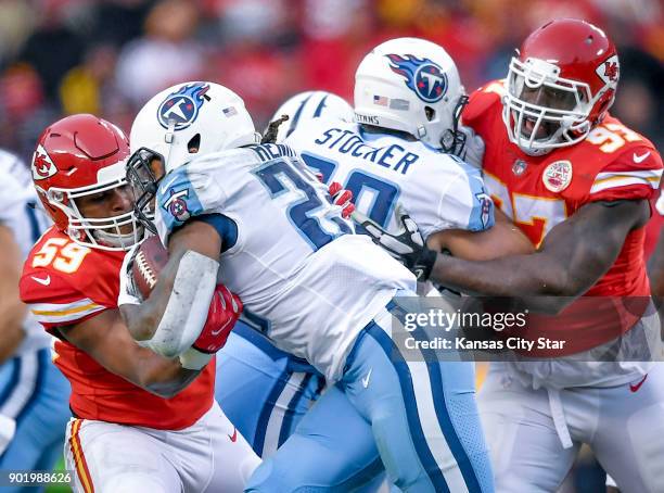 Kansas City Chiefs inside linebacker Reggie Ragland tried to strip the ball from Tennessee Titans running back Derrick Henry in the second quarter on...