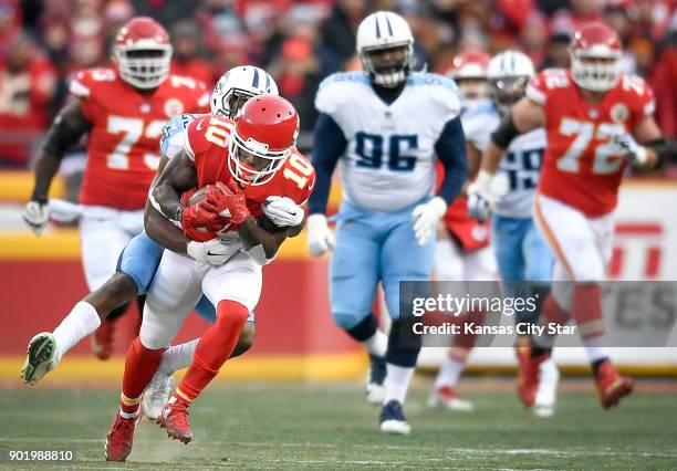 The Tennessee Titans' Adoree' Jackson drags down Kansas City Chiefs wide receiver Tyreek Hill in the first quarter on Saturday, Jan. 6 during the AFC...