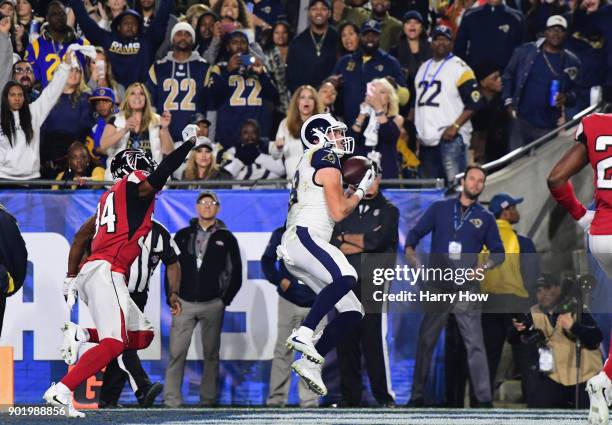 Wide receiver Cooper Kupp of the Los Angeles Rams makes a catch for a touchdown in front of cornerback Brian Poole of the Atlanta Falcons during the...