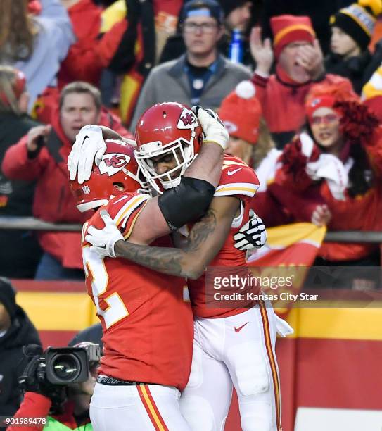 Kansas City Chiefs wide receiver Demarcus Robinson celebrates his second-quarter touchdown offensive tackle Eric Fisher against the Tennessee Titans...