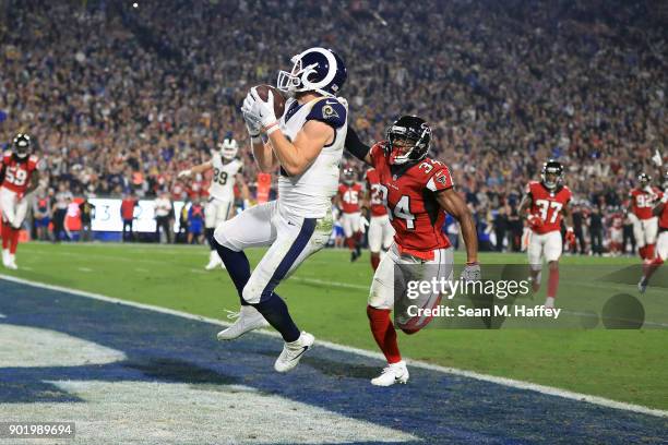 Cooper Kupp of the Los Angeles Rams makes a catch for a touchdown in front of cornerback Brian Poole of the Atlanta Falcons during the NFC Wild Card...