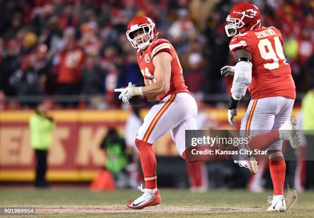 Kansas City Chiefs outside linebacker Frank Zombo looks over his shoulder after picking up the ball during a failed two-point conversion attempt by...