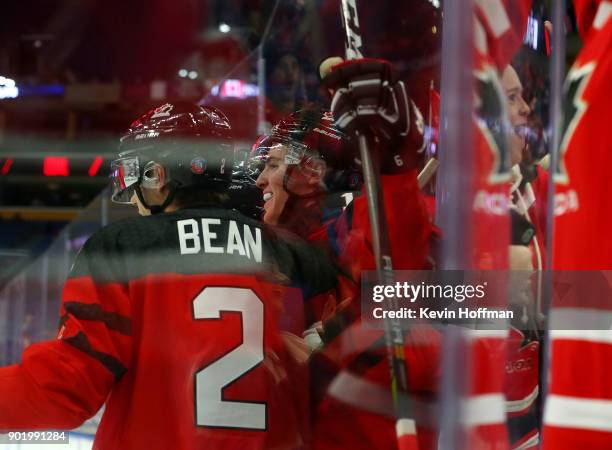 Drake Batherson celebrates his goal against Czech Republic with Jake Bean of Canada during the IIHF World Junior Championship at KeyBank Center on...