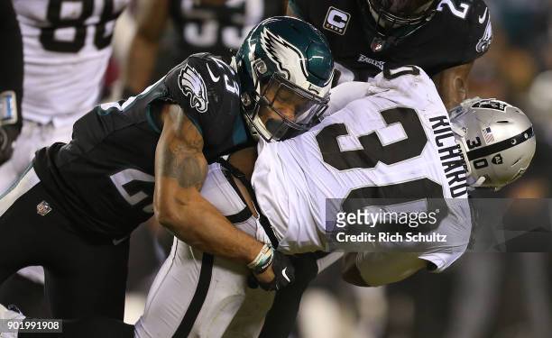 Rodney McLeod of the Oakland Raiders is grabbed by Malcolm Jenkins of the Philadelphia Eagles during the fourth quarter of a game at Lincoln...