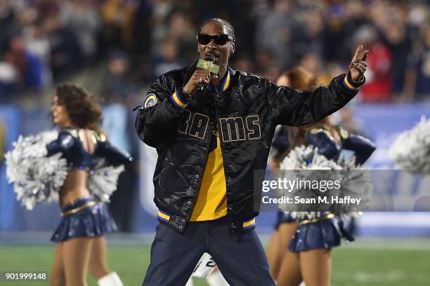 Rapper Snoop Dogg performs during halftime at the NFC Wild Card Playoff Game between the Los Angeles Rams and Atlanta Falcons at the Los Angeles...