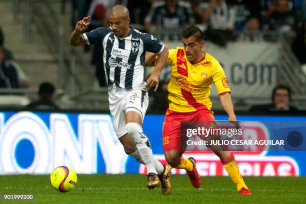 Carlos Sanchez of Monterrey vies for the ball with Aldo Rocha of Morelia during the Mexican Clausura 2018 tournament football match at the BBVA...
