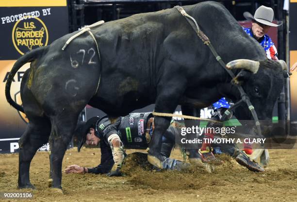 Professional bull rider J.B. Mauney falls off Mr. Miller during the 2nd round of the Monster Energy Buck Off at Madison Square Garden in New York on...