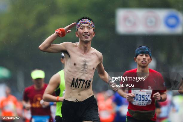 People participate in the 2018 C&D Xiamen Marathon in the rain on January 7, 2017 in Xiamen, Fujian Province of China.