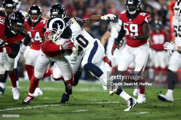 Todd Gurley of the Los Angeles Rams runs the ball down field during the NFC Wild Card Playoff Game against the Atlanta Falcons at the Los Angeles...