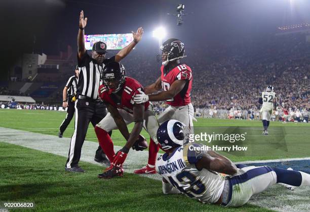 Wide receiver Julio Jones of the Atlanta Falcons makes a touchdown catch in front of strong safety John Johnson of the Los Angeles Rams as wide...