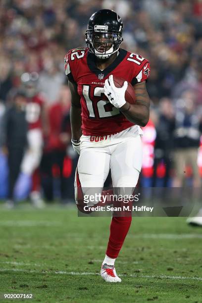 Mohamed Sanu of the Atlanta Falcons runs the ball during the NFC Wild Card Playoff Game against the Los Angeles Rams at the Los Angeles Coliseum on...