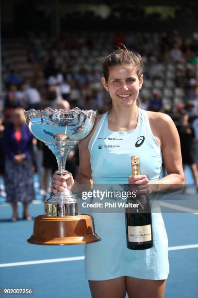 Julia Goerges of Germany poses with the trophy following her Womens Singles Final win against Caroline Wozniaki of Denmark during day seven of the...