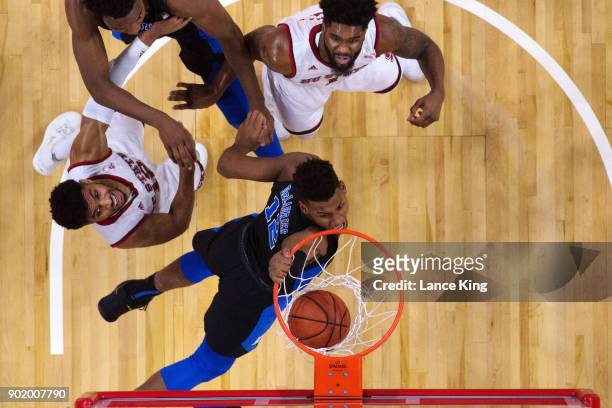 Javin DeLaurier of the Duke Blue Devils dunks the ball against the North Carolina State Wolfpack at PNC Arena on January 6, 2018 in Raleigh, North...