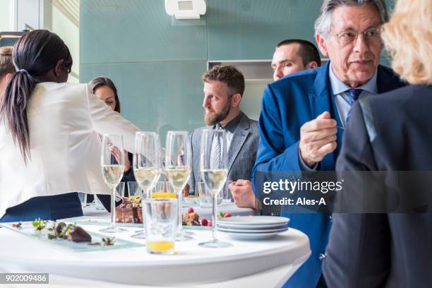 business event - chat canapé stock pictures, royalty-free photos & images