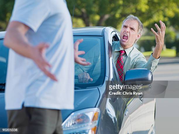 angry driver shouting at pedestrian blocking road - agressie stock pictures, royalty-free photos & images
