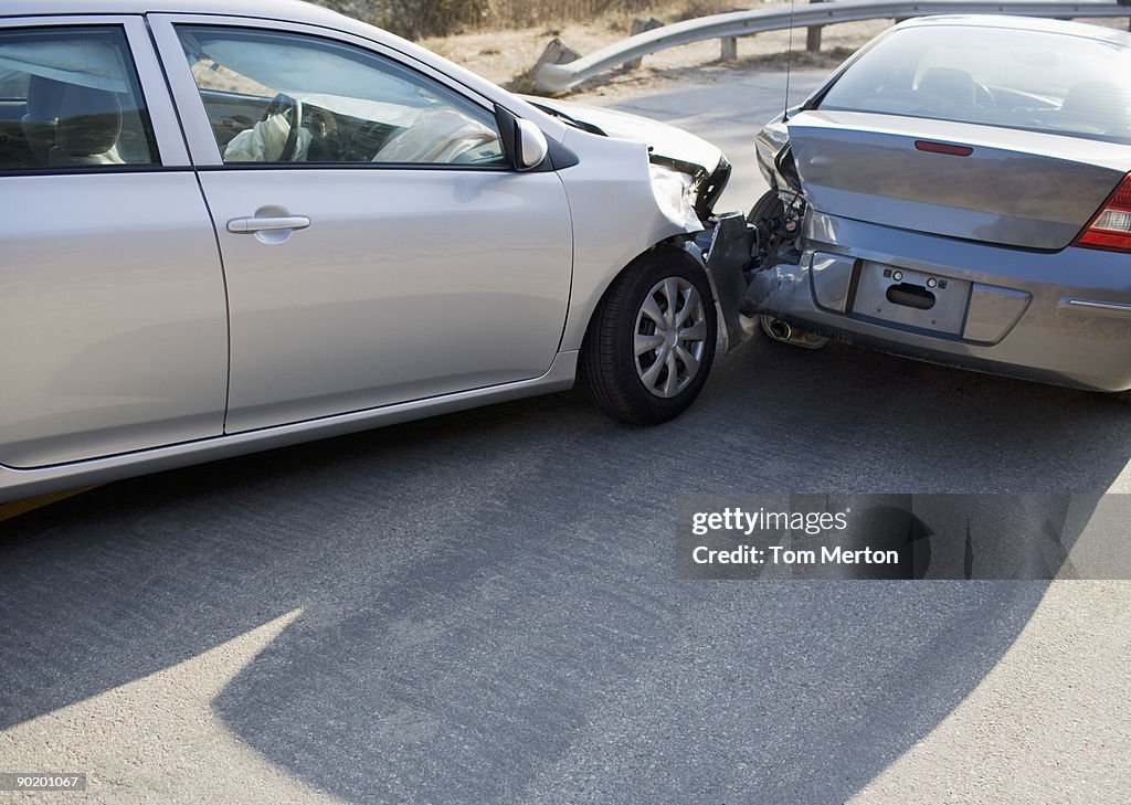 Two cars in collision on roadway