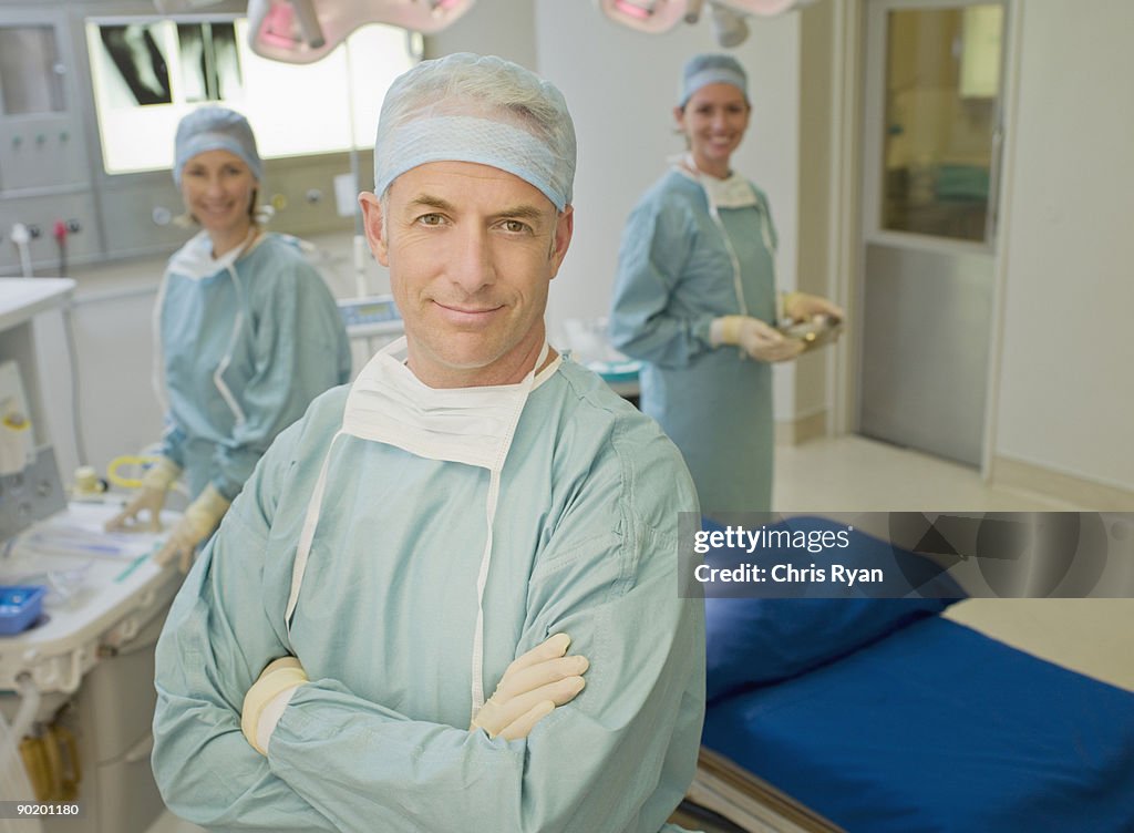 Surgeons preparing for surgery in operating room