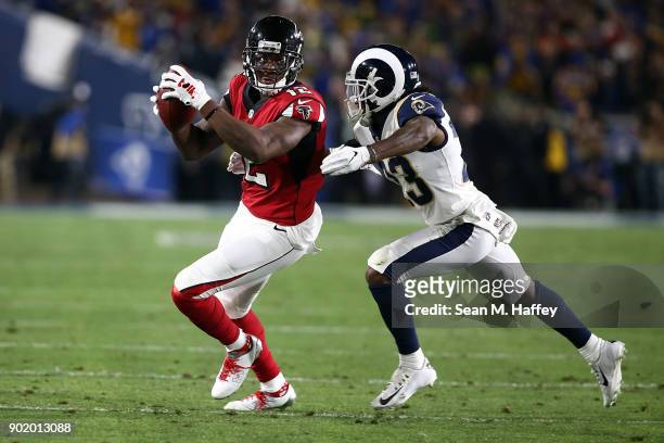 Nickell Robey-Coleman of the Los Angeles Rams directs Mohamed Sanu of the Atlanta Falcons out of bounds after making the catch during the NFC Wild...