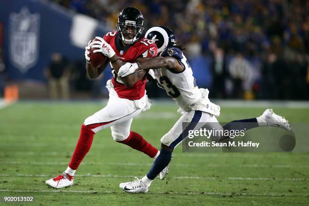 Nickell Robey-Coleman of the Los Angeles Rams directs Mohamed Sanu of the Atlanta Falcons out of bounds after making the catch during the NFC Wild...