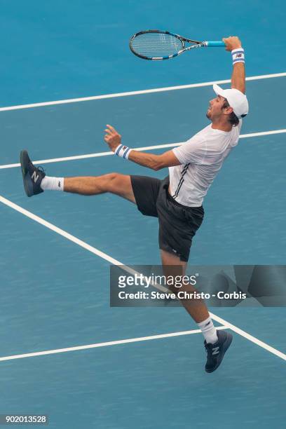 Jordan Thompson of Austraila plays an overhead shot in his first round match against Paolo Lorenzi of Italyduring day one of the 2018 Sydney...