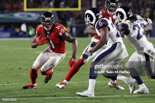 Julio Jones of the Atlanta Falcons attempts to get past the Los Angeles Rams during first half of the NFC Wild Card Playoff Game at the Los Angeles...