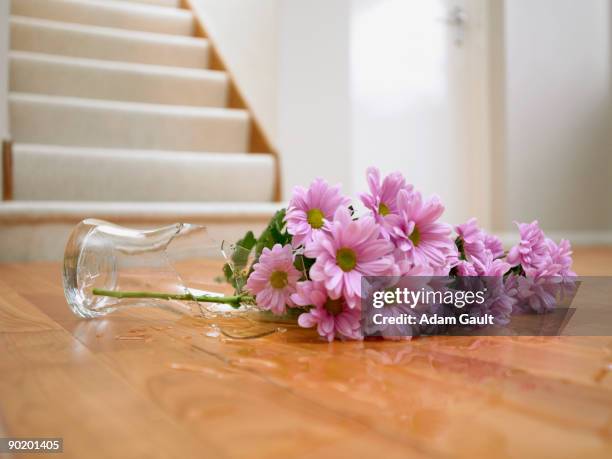 broken vase of flowers on floor - broken vase stock pictures, royalty-free photos & images