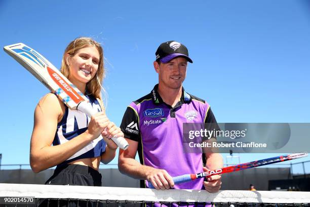 Eugenie Bouchard of Canada poses with Australian cricketer George Bailey during Day One of 2018 Hobart International match at Domain Tennis Centre on...