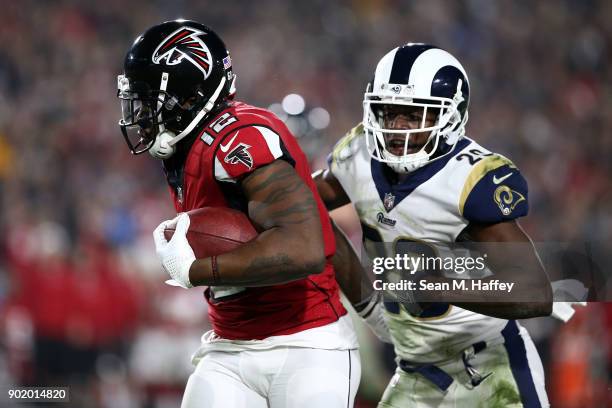 Mohamed Sanu of the Atlanta Falcons runs down field in front of Lamarcus Joyner of the Los Angeles Rams during the NFC Wild Card Playoff Game at the...