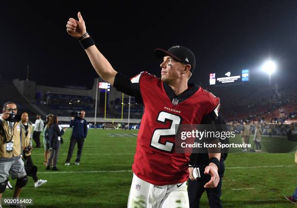 Atlanta Falcons Matt Ryan gives a thumbs up to the fans to celebrate the victory during the NFC Wild Card football game between the Atlanta Falcons...