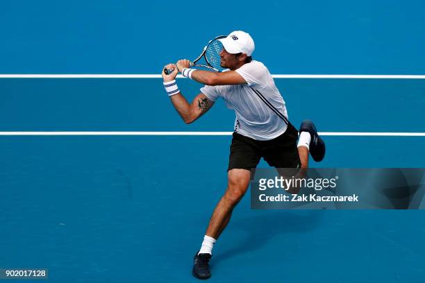 Jordan Thompson of Australia plays a backhand in his first round match against Paolo Lorentzi of Italy during day one of the 2018 Sydney...